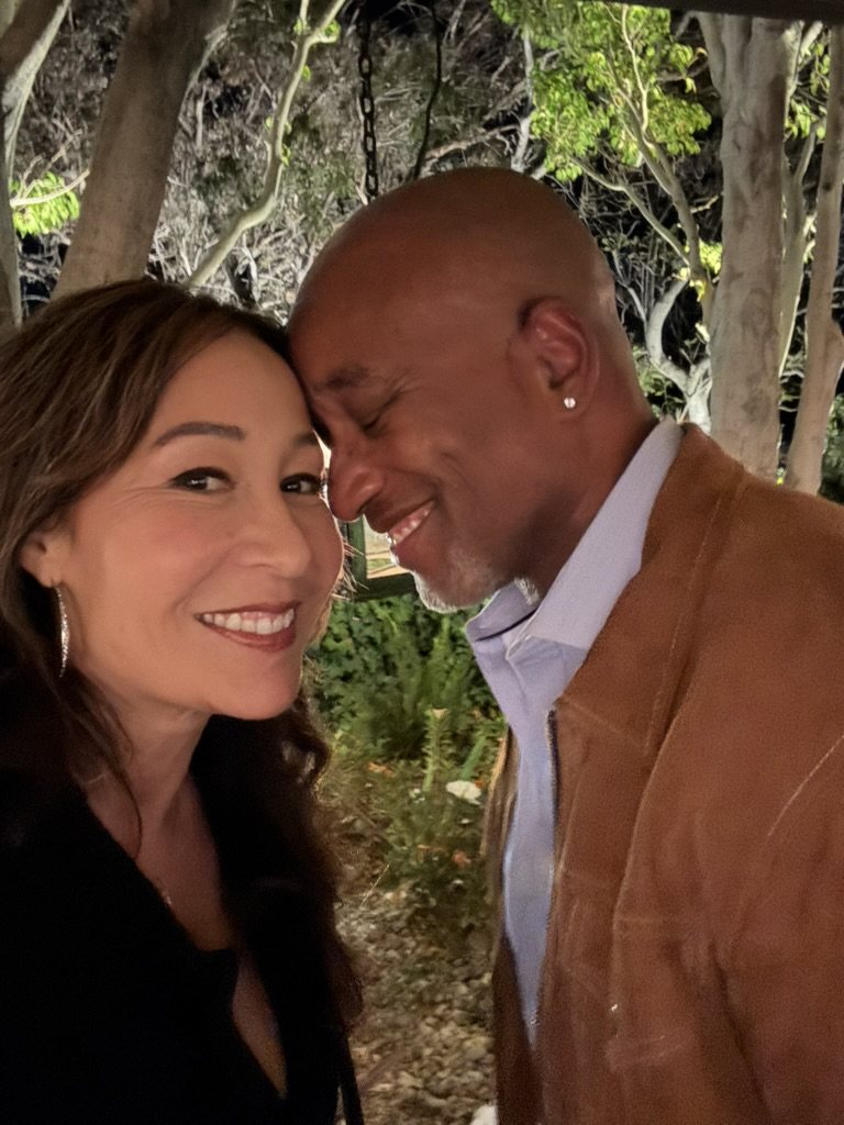 Lisa and Nicolas in a garden at night